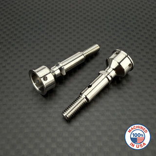 A set of R1WURKS ultra lightweight rear CVA axles in various colors including silver, blue, and gold, positioned on a textured dark background.