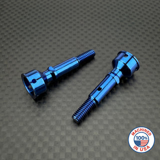 A set of R1WURKS ultra lightweight rear CVA axles in various colors including silver, blue, and gold, positioned on a textured dark background.
